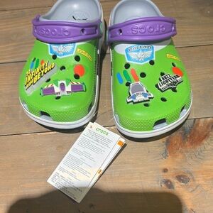 New with tags Crocs Kids Green and Purple Clogs